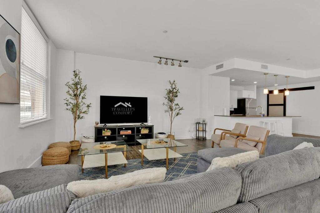 a living room with a couch and a table at HEB 104 Spacious Condo Downtown Fort Worth, Free Parking, Gym in Fort Worth