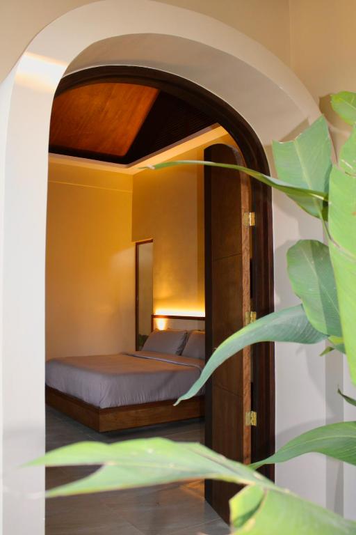 a bedroom with a bed in a room at Mawari Sanctuary Villa El Nido in El Nido