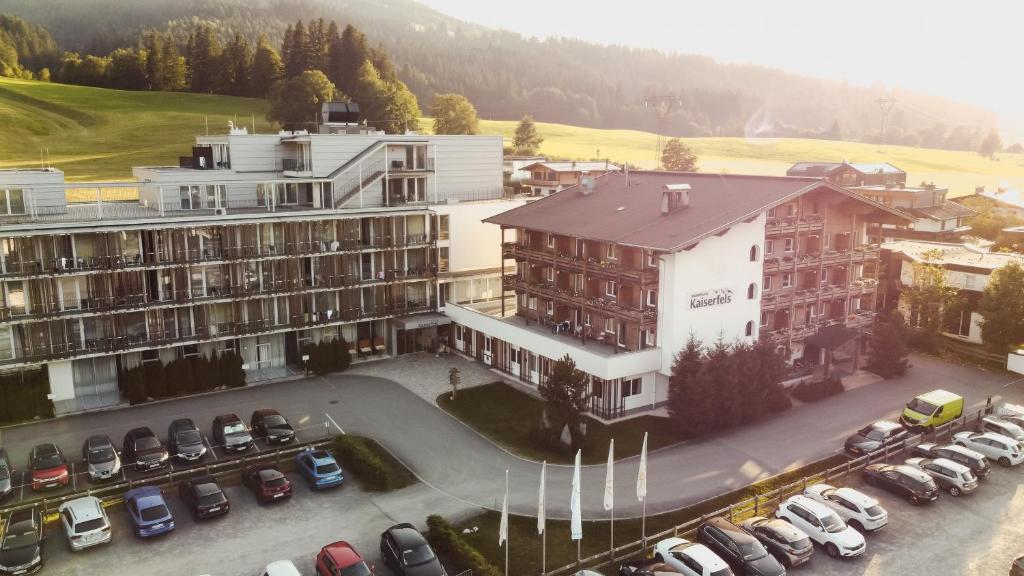 an aerial view of a parking lot in front of a building at Alpenhotel Kaiserfels in Sankt Johann in Tirol