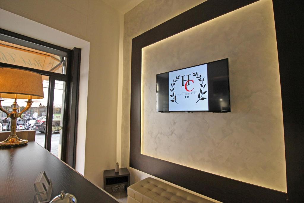 TV a/nebo společenská místnost v ubytování Hotel Charter