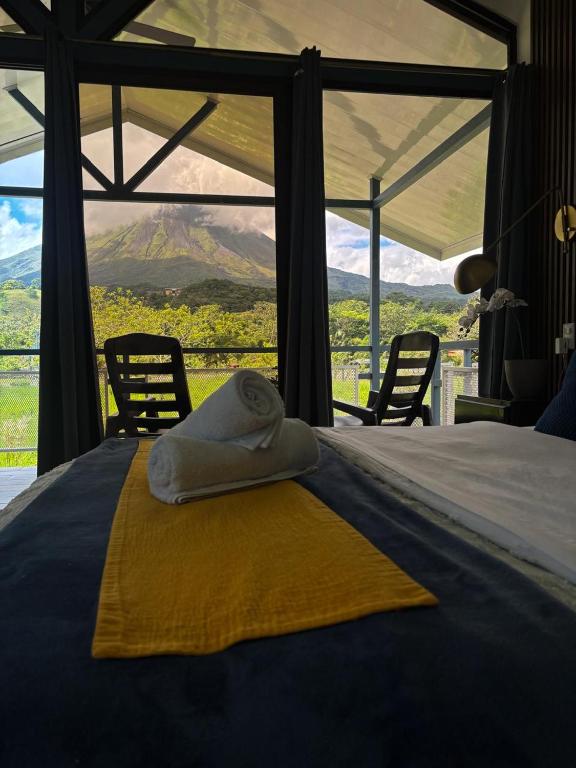 a bedroom with a bed with a view of a mountain at Suite Palm in Palma