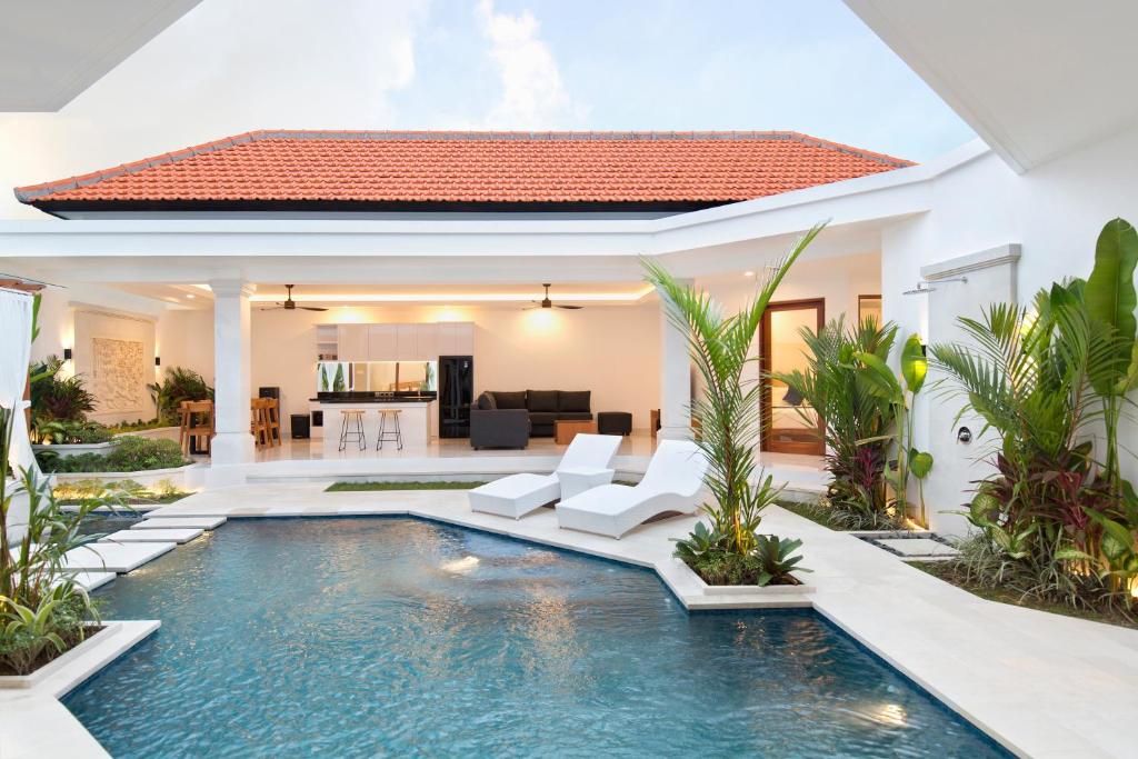 a pool in the backyard of a villa at Villa Mia Seminyak - Boutique Villas - I in Seminyak