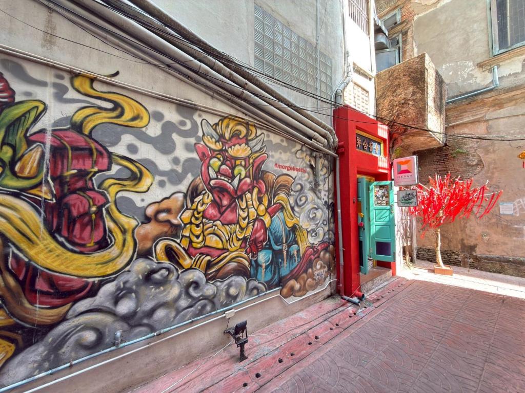 a painting on the side of a building at Merge Hostel Chinatown in Samphanthawong