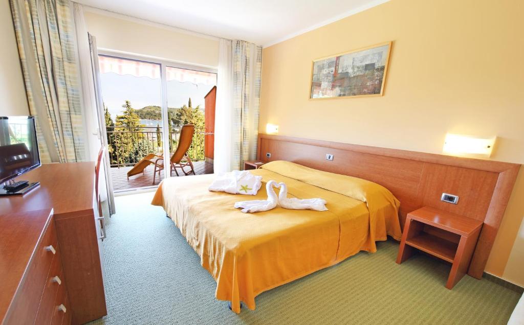 Postel nebo postele na pokoji v ubytování Bioenergy Resort Salinera Hotel
