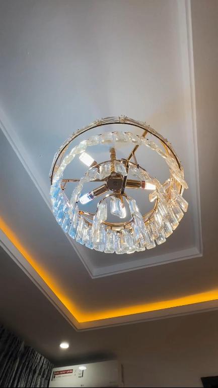 a chandelier on the ceiling of a room at Luxury Homes in Lagos