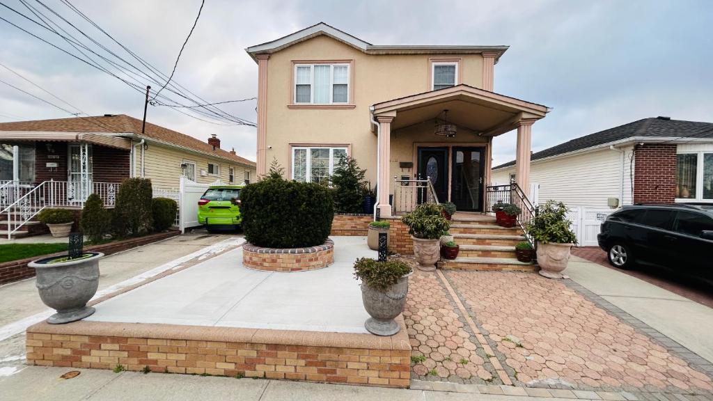 a house on a street with a driveway at Casseus J Legacy in Rosedale