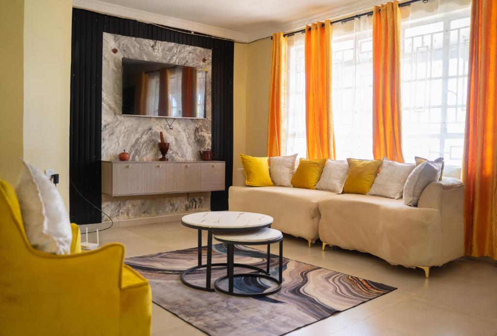 a living room with a couch and a table at The Residence in Lilongwe
