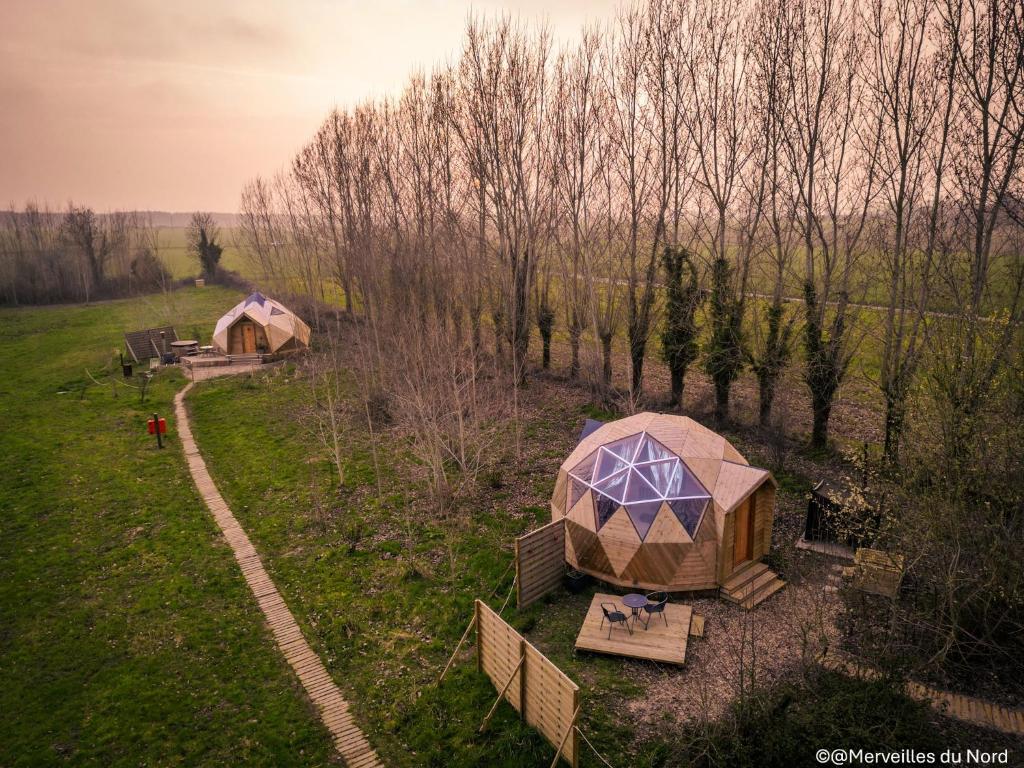 an overhead view of two tents in a field at Les Dômes de Draëck in Zutkerque