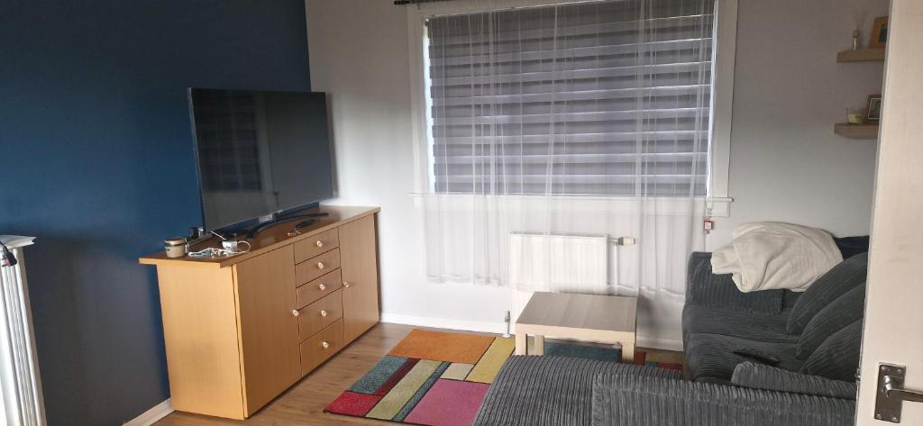 a small room with a dresser and a window at Double room in rosyth in Rosyth