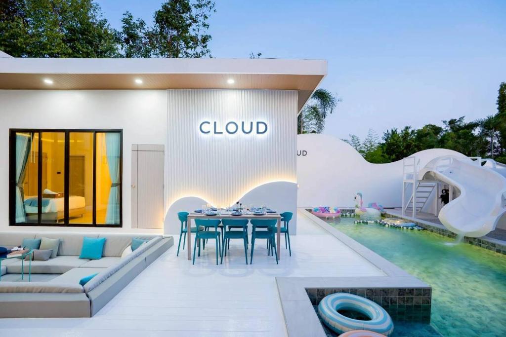 a villa with a pool and a pool slide at Cloud Pool Villa Pattaya in Na Jomtien