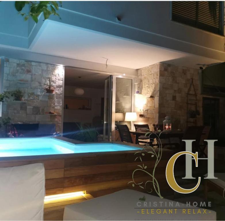 a swimming pool in a villa at night at Cristina Home in Taranto