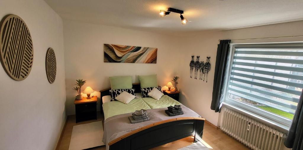 a bedroom with a bed and a window in it at Birkenhain in Geltorf