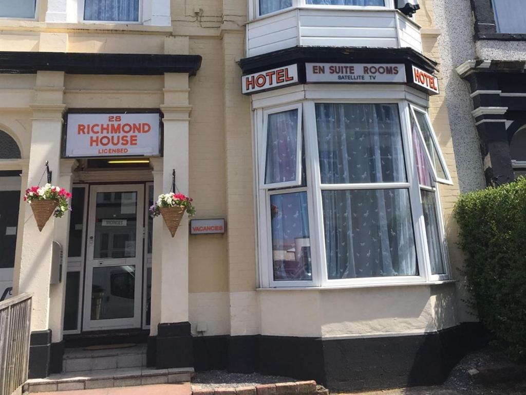 a hotel building with a hotel sign on it at Richmond House Hotel in Southport