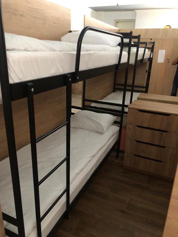 a couple of bunk beds in a room at Міні Готель Особняк in Lviv