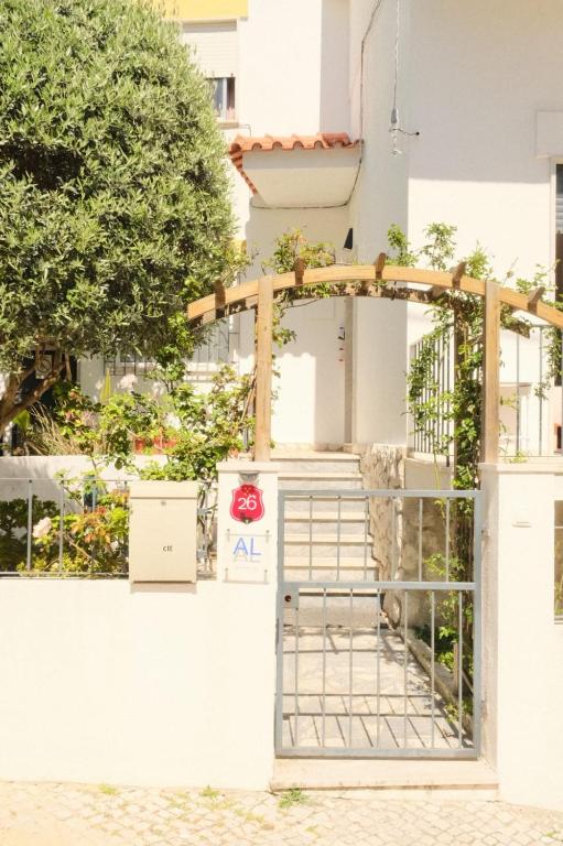an entrance to a building with a gate at Flamingo's Bay in Corroios