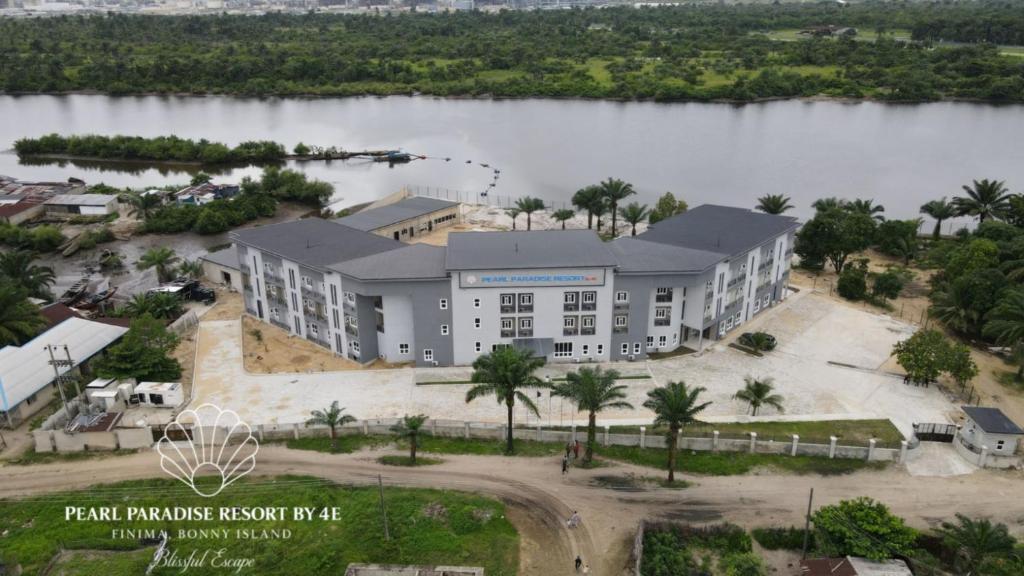 an aerial view of a building next to a lake at Pearl Paradise Resort by 4E in Finima