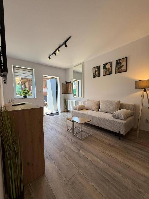 a living room with a couch and a table at Hostel Róża in Żywiec