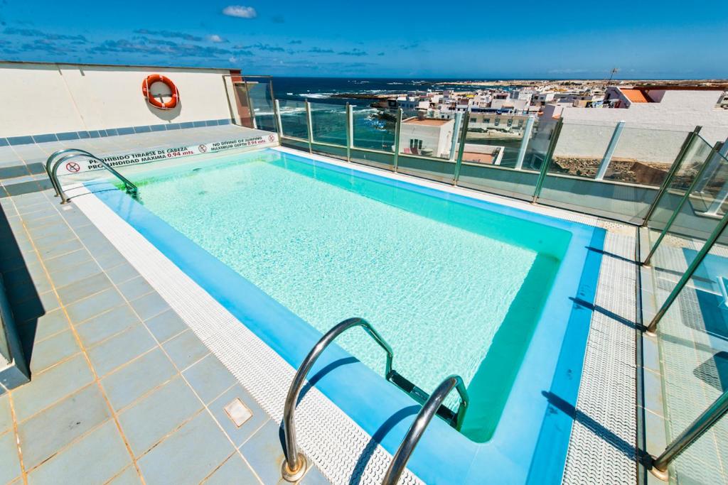 a swimming pool on the roof of a building at Casa Mika Oliastur 25 El Cotillo in El Cotillo