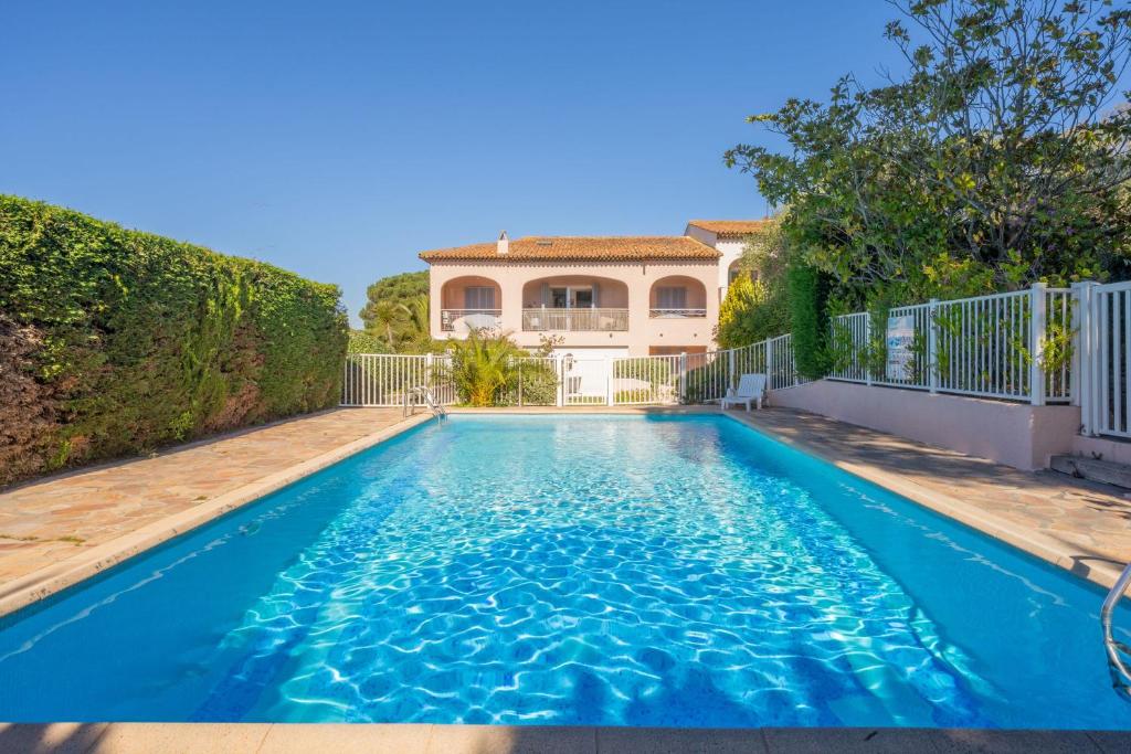 a swimming pool in the backyard of a house at 6P apartment in a Citadelle with POOL - Saint-Tropez in Saint-Tropez
