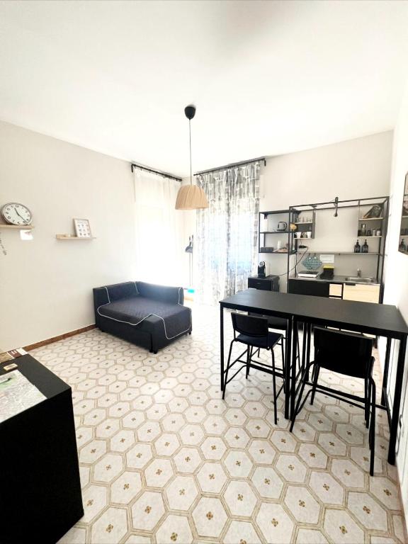 a living room with a table and a couch at TERRA DI SUD Matera - Free secure parking in Matera
