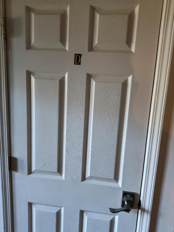 a white door with two glass panels on it at Kings Bay Private Room Shared Bathroom D in Decatur