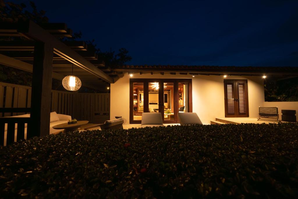 a house with a patio at night at Royal Isabela in Isabela