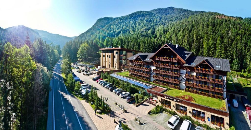 an aerial view of a hotel in the mountains at Wellness Hotel Chopok in Belá