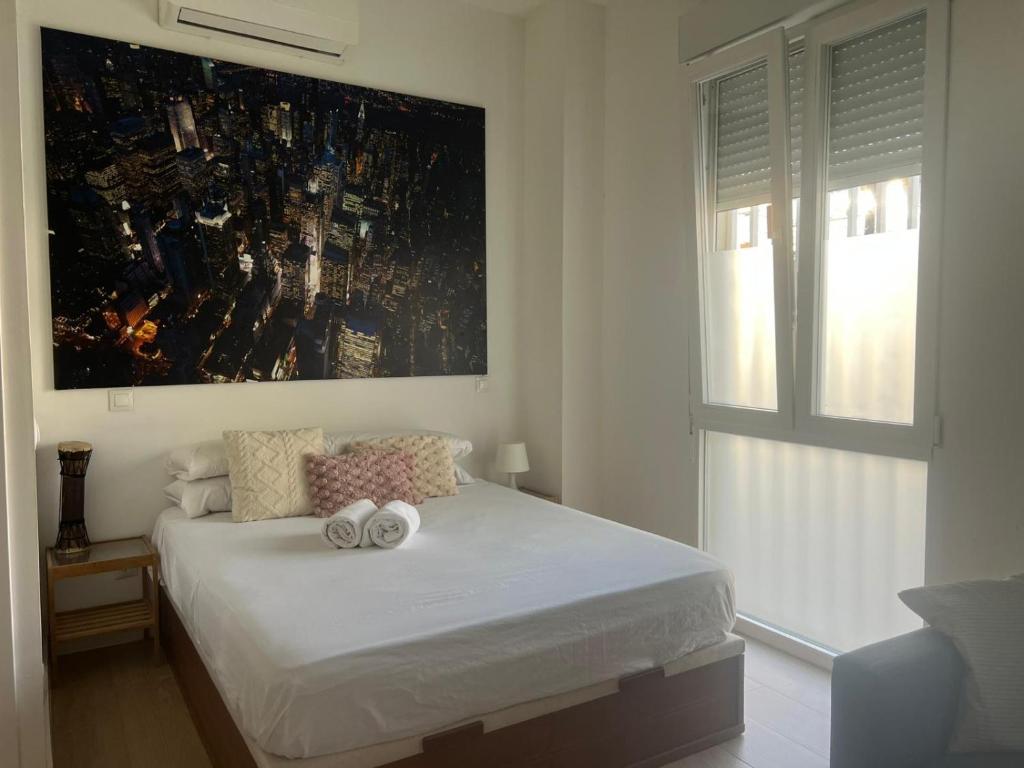 a bedroom with a bed with two towels on it at Cozy apartment in Leganés in Leganés