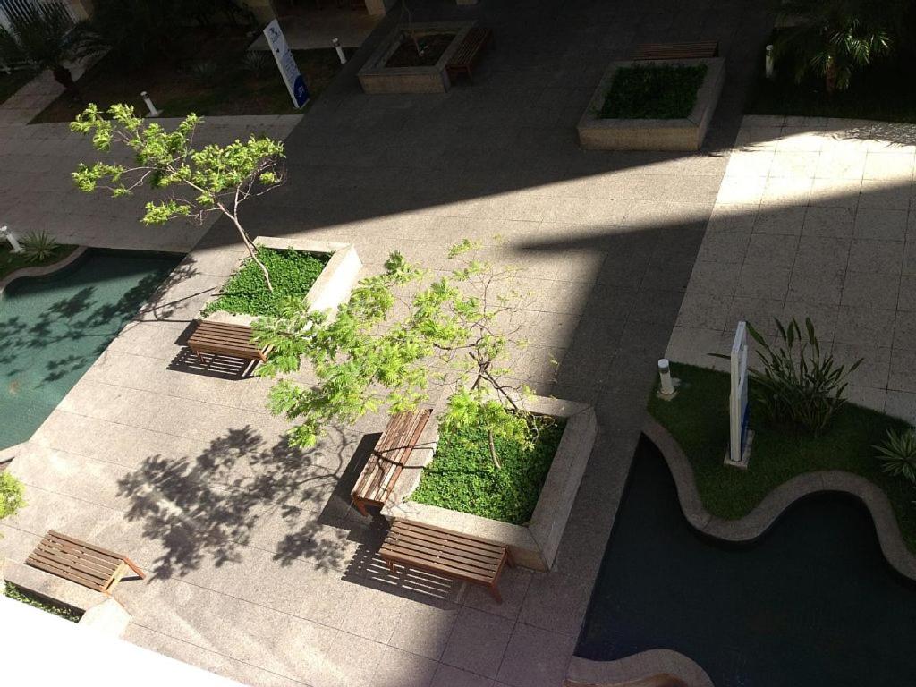 an overhead view of a garden with benches and trees at Jatiuca Trade Residence(JTR) in Maceió