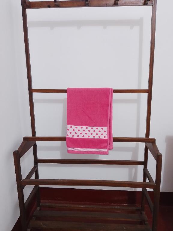 a pink towel sitting on top of a shelf at Ruwanthera Eco Resort in Ruwanwella
