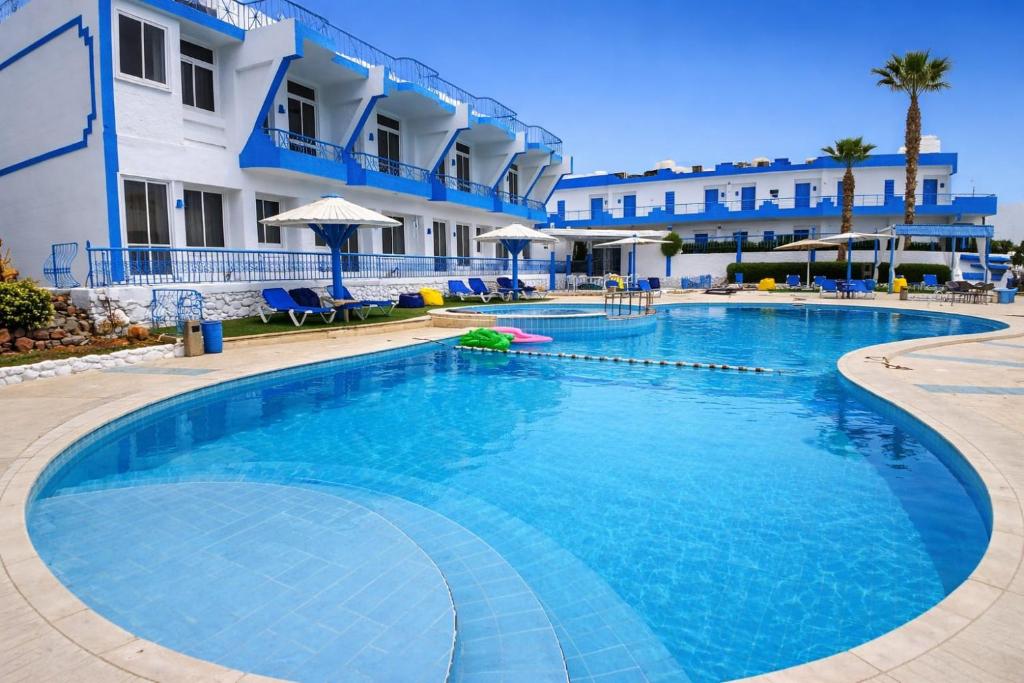 a large swimming pool in front of a building at Regency Hotel Sharm in Sharm El Sheikh