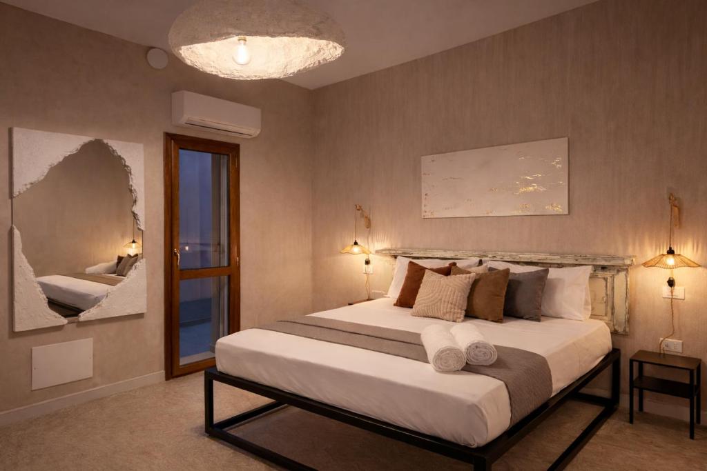 a bedroom with a large bed and a window at Sant'Agostino in Pizzo