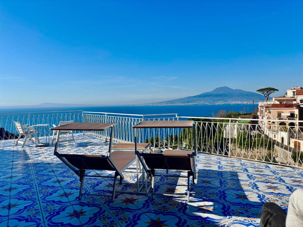 a balcony with a view of the water at The Dreamer's Terrace in Vico Equense