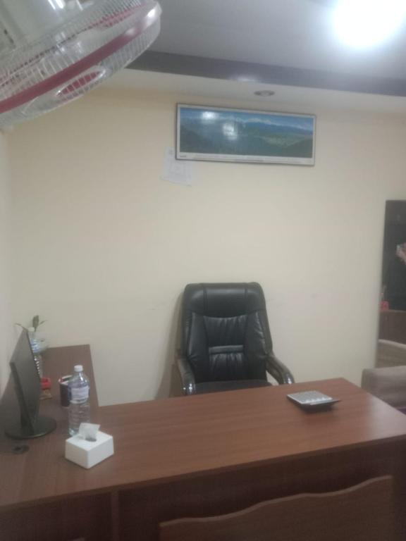 an office with a desk and a black chair at De Hotel Veda Pvt Ltd in Thapathali