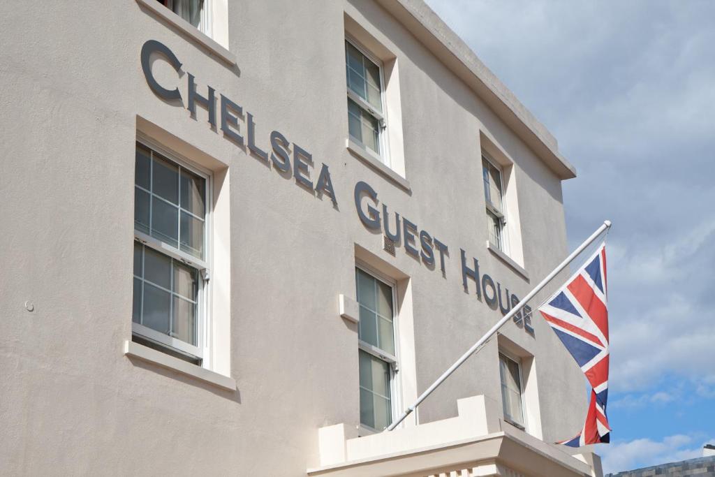a building with a british flag in front of it at Chelsea Guest House in London