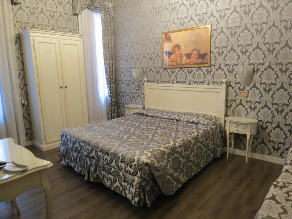 Postel nebo postele na pokoji v ubytování Hotel Bridge