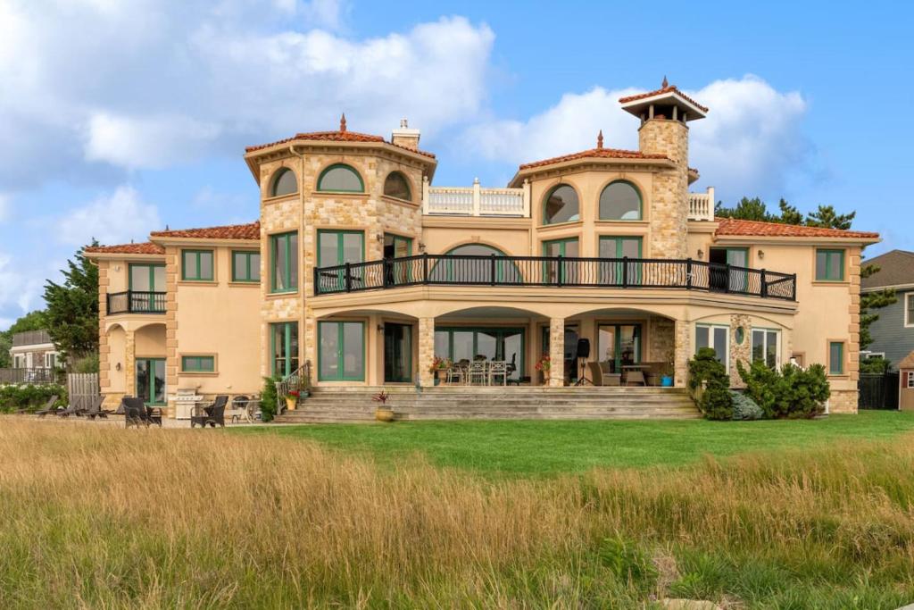 a large estate with a large house at Hamptons Romantic Waterfront Queen Suite in Remsenburg