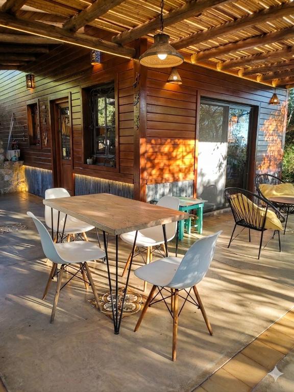 a wooden table and chairs on a patio at Casa Atardecer San Javier in San Javier