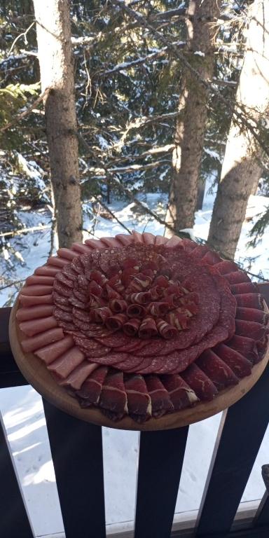 a chocolate cake on a plate on a table at Ruza Vetrova a4 in Nova Varoš