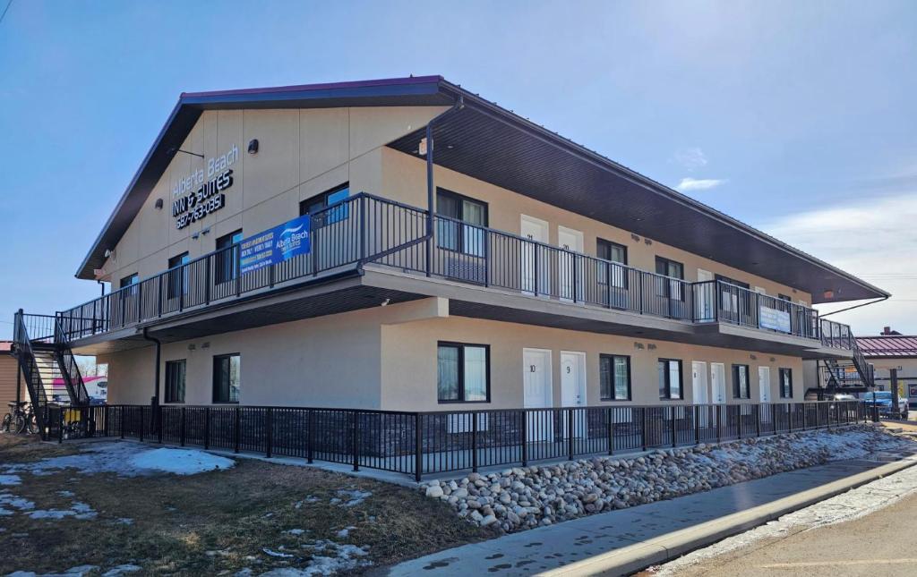 a building with a balcony on the side of it at Alberta Beach Inn and Suites in Albert Beach (Alberta)