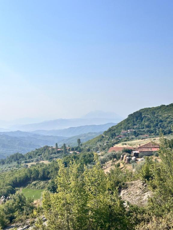 a view of a valley with hills and trees at Bodini Mountain House in Peqin