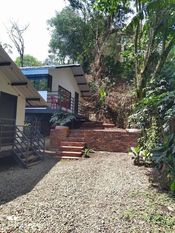 a house with a brick staircase in front of it at Cabañas Bosque Encanto - Jacuzzi in San Francisco
