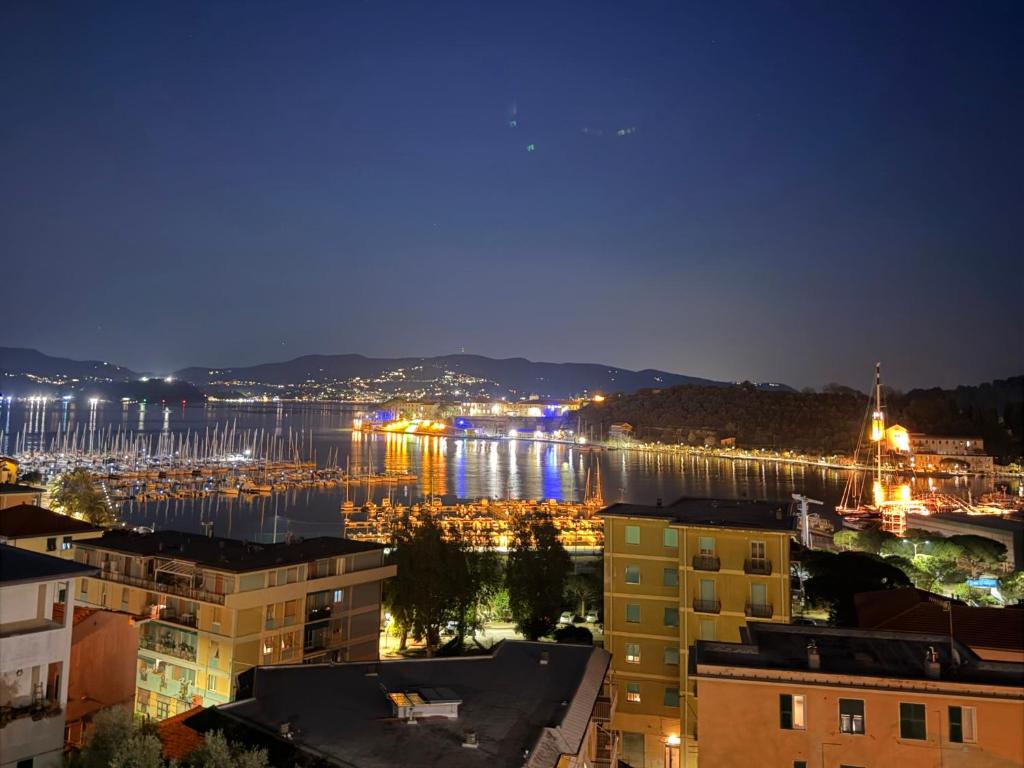 a view of a harbor at night with boats in the water at Terrazza Portovenere in Le Grazie
