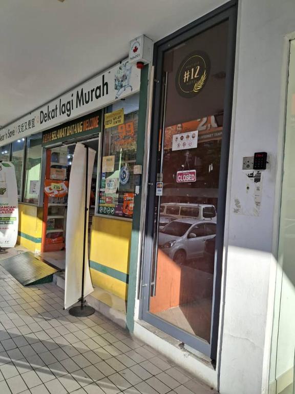 a store front with doors open in a building at BlackView in Kota Kinabalu