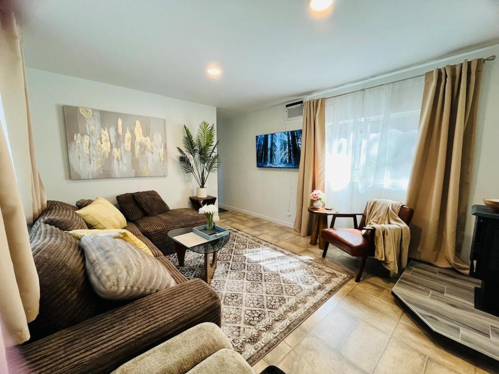 a living room with a couch and a table at Dafna, Unit 3 - Two Bedroom, One Bath in Cromberg