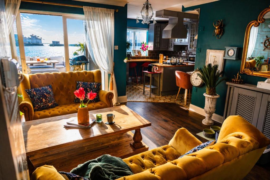 a living room with a couch and a table at Dog-friendly Seaview Apartment in Dungarvan