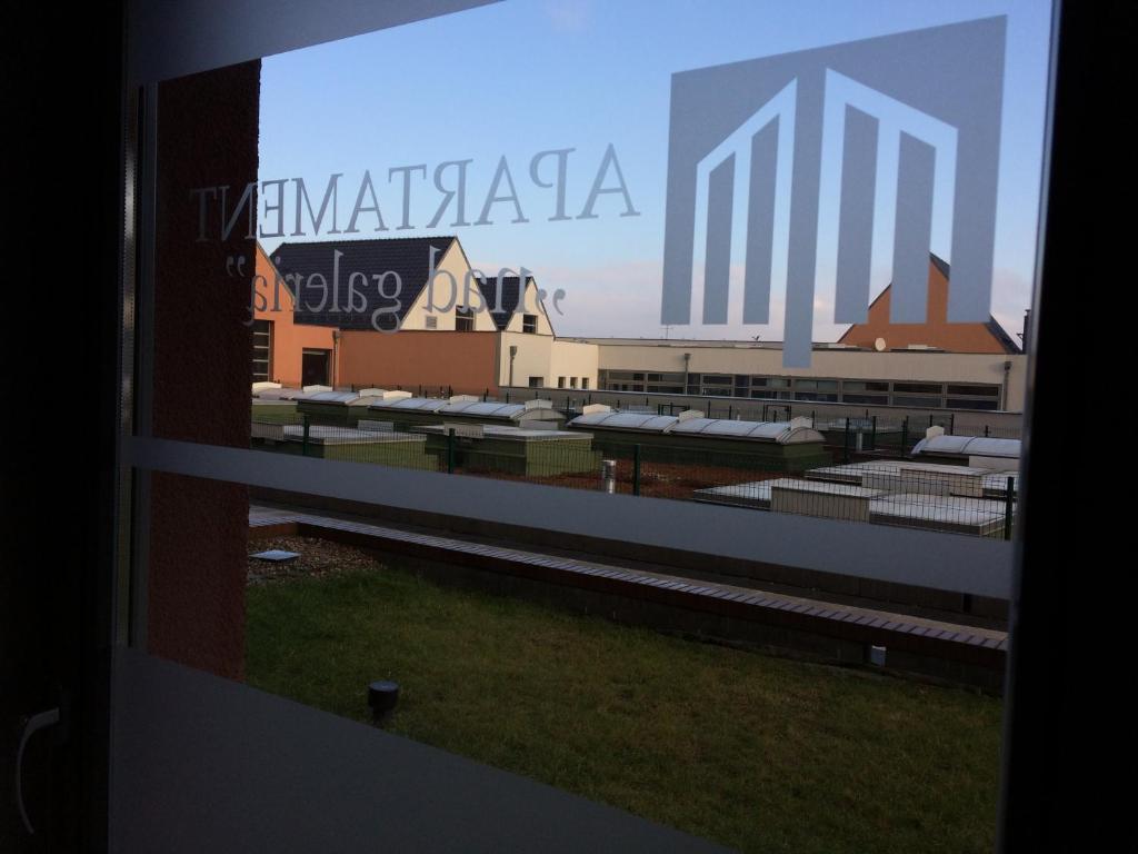 a view from a window of a building with a sign at Apartament Nad Galerią in Stargard