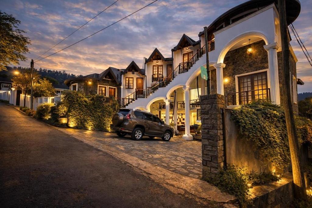 a car parked in front of a house at night at The Ramp in Nuwara Eliya