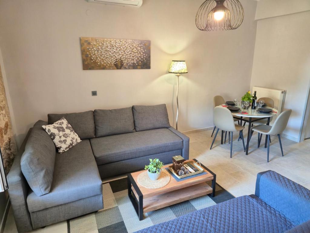 a living room with a couch and a table at Sogno 2 in Parga