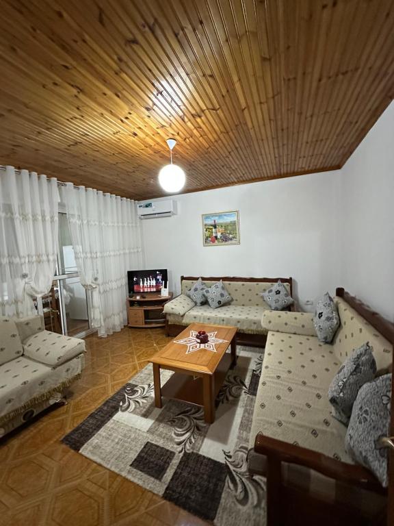 a living room with a couch and a table at Sweet home Leskovik in Leskovik